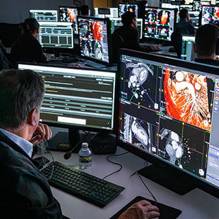 Green background with drawing of instructor presenting to attendees