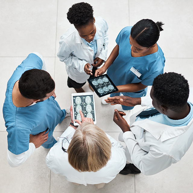 Overhead of docs reviewing images on ipad