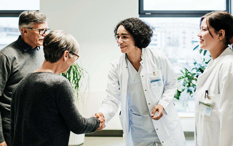 Doctors shaking hands with patients