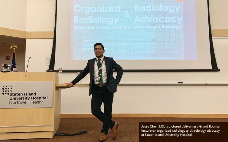 Dr. Jesse Chen at podium delivering presentation