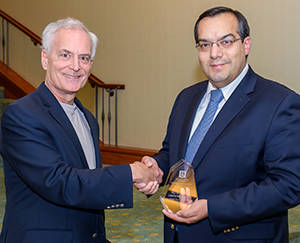 Photo: Frank Lexa presents and award to Syed Zaidi