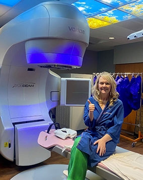 Photo: Dana Caviness sits on scanner