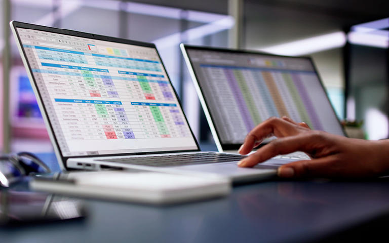 closeup of laptop entering medical billing codes