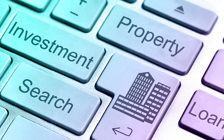 Color tinted image of a computer keyboard with keys labels: Property, Investment, Search, Loan
