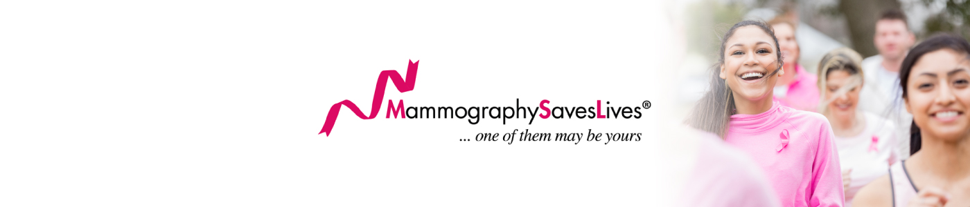 Depicts a group of women nearing the end of a breast cancer awareness run