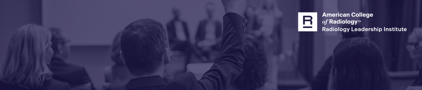 Image of a man asking a question at a conference