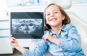 Child holding xray image