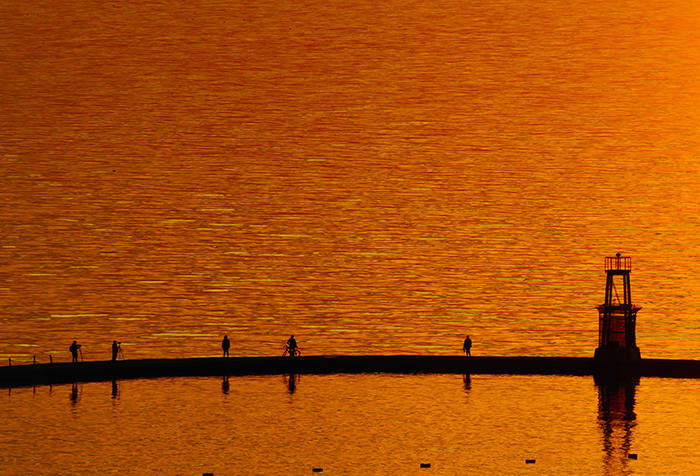 Photo of sun reflecting on the water at North Avenue Beach in Chicago on a bright fall morning, by Suresh K. Patel, MD
